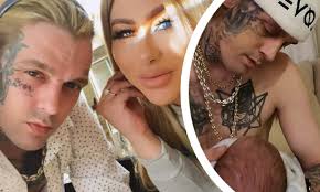 Aaron Carter 'is back on' with on/off fiancee Melanie Martin as he 'gushes'  about her