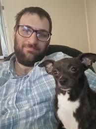 My Trixie loves the sun and rides in the car. Also loves to sleep next to  her dad.