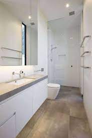 Browse our inspiring bathroom tile ideas gallery comprised of modern bathroom tiles designs and beautiful tile color schemes in each style and budget to get a sense of what you desire for. 39 Galley Bathroom Layout Ideas To Consider Narrow Bathroom Designs Modern Small Bathrooms Bathroom Design Small