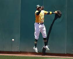 Oakland Athletics Center Fielder Rajai Davis 11 Cannot Grab A Bounce Off The Wall On A Triple By Washington Na Baseball Camp Baseball Games Oakland Athletics