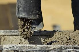 Once the entire floor is covered, go back over the concrete with a trowel or concrete floater to smooth out the top layer. How Long Should I Leave Dirt Before Pouring Concrete