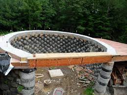 Rammed earth tires can weigh up to 300 lb (140 kg), so they are. Large Earthship Homes Cronk Earthship Tire House Rammed Earth Passive Solar Earthship Earthship Home Earth Bag Homes