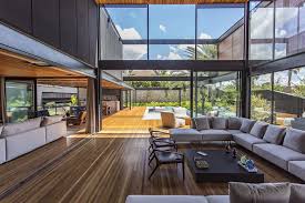 The home sits on a steep slope surrounded by beautiful trees you can see from every angle. Modern Residence In Brazil Features Stones Wood Glass And Metal Idesignarch Interior Design Architecture Interior Decorating Emagazine