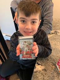 Got some friends and their sons together for an awesome night of breaking  packs. Pulled this bad boy! Never pulled Jordan's as a kid. Took till I was  41 to get one 😀
