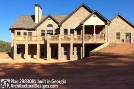 Plan 29830rl Rustic Style Ranch For A Rear Sloping Lot Architectural Design House Plans Ranch House Plans Basement House Plans