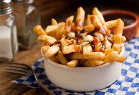 The thin fries are laying down to accommodate gravy and. 10 Things You Probably Didn T Know About Poutine Cottage Life