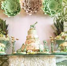 For a perfect jungle theme, turn the room or backyard into a wild jungle with green, yellow, brown balloons, streamers, real or craft plants and hanging ropes here and there to mimic the vines of the jungle and hang some stuffed monkeys or green paper cut leaves on the vine or the wall. Safari Baby Shower Ideas Cute Creative And Easy Colleen Michele