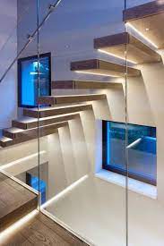 Oak And Glass Staircase With Led Lighting Strips Decoist Staircase Design Modern Staircase Glass Staircase