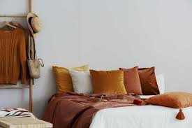 A warm orange blending with neutrals can be calming while pops of orange in the throws, draperies and displays can spice up the overall look and even create a happy feel. Orange Bedroom Ideas