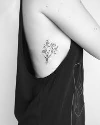 How about this for a flower collage? Small Minimalist Wildflower Tattoo With Fine Black Lines And Detailing Flower Tattoo Black Tattoo Fe Wildflower Tattoo Feminine Tattoos Small Flower Tattoos