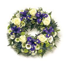 A pop of blue in funeral flowers makes a stunning display when combined with other flower arrangements. Funeral Flowers Uk Free Delivery Serenata Flowers