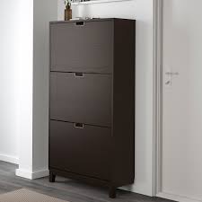 The cabinet only has legs at the front so it can stand close up to the wall above the baseboard. Stall Shoe Cabinet With 3 Compartments Black Brown 79x29x148 Cm Ikea