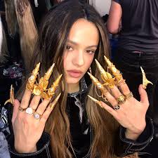 Come for the exceptional dancing, stay for all the bejeweled nails. Rosalia Shows Off Fierce Gold Nails From Aute Cuture Music Video