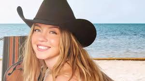 Sydney Sweeney dazzles in swimsuit and cowgirl hat for sizzling beach shoot  for shoe brand | The Irish Sun