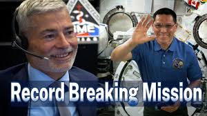 SPACE STATION ASTRONAUT DISCUSSES RECORD BREAKING MISSION WITH PREVIOUS  RECORD HOLDER