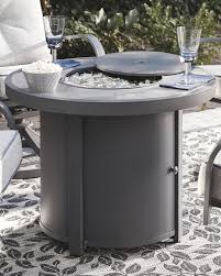 Types of fire pit tables we have a wide selection of fire pit tables to choose from. Donnalee Bay Round Fire Pit Table P325 776 Fire Pits Sadtk S Furniture And Bedding