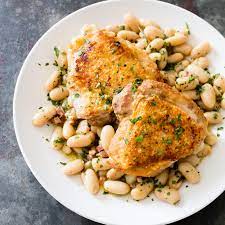 An easy baked keto chicken thighs recipe that uses a trick from cooks illustrated to get the bone in chicken thigh skin nice and crispy! Chicken Thighs With Pancetta White Beans And Rosemary Cook S Country