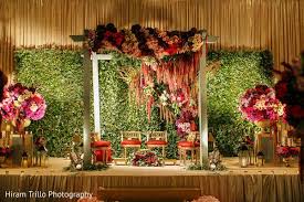 Gorgeous Indian Wedding Stage With Green Backdrop Http Www Maharaniweddings C Indian Wedding Stage Wedding Decorations On A Budget Indian Wedding Decorations