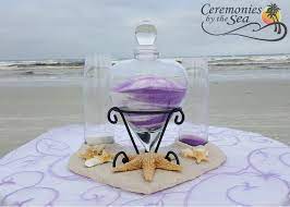 Lillian Rose Unity Sand Ceremony Lilac Purple White Beach Wedding Ideas Heart Base With Sea Shel Wedding Rentals Decor Wedding Arch Rental Wedding Arch