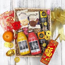 This Hamper Of Happiness Comes With Two Bottles Of Revitalize Juice And A Bunch Of Snacks For The Coffee Table Have Your Wishes And Blessings All Packed In One