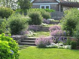 Three Sets Of Steps Of Solid Stone Pavers Descend Gently Through Terraced Beds To Soften The Formality Plan Estate Garden Sloped Garden Terrace Garden Design