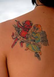 This tattoo showcases that duality. Angel And Devil Tattoos Lovetoknow