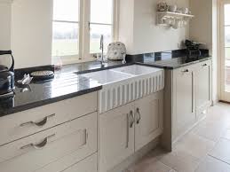 Preparing food on kitchen worktop, cutting boards, herbs. Jm Interiors Shaker Kitchens Jm Interiors