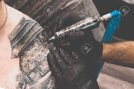 The fda issued a safety advisory on may 15, 2019 warning consumers, tattoo artists, and retailers about using or selling certain tattoo inks contaminated with microorganisms. Tattoo Salon The Tattoo Master Is Tattooing A Man On His Shoulder Stock Photo Picture And Royalty Free Image Image 149657226