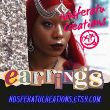 Silver chainmail earrings.