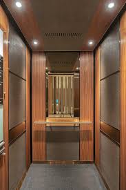 Levele 105 Elevator Interior With Customized Panel Layout Capture Panels In Bonded Bronze With Dark Elevator Interior Elevator Design Interior Design Programs
