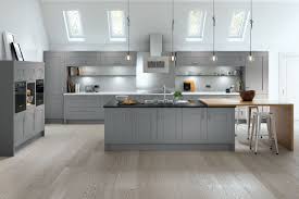 This kitchen design makes use of the great natural light and blends two neutral colours on the cabinetry for a bright, airy feel. Camden Shaker Kitchen In Dusty Grey Grey Shaker Kitchen Replacement Kitchen Doors Modern Shaker Kitchen