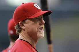 St. Louis Cardinals catcher Gerald Laird (13) and pitcher Kyle McClellan  (46) and pitching coach Dave Duncan (18) walk