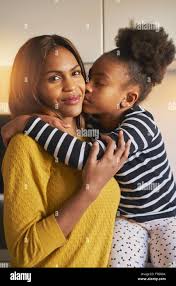 Portrait of beautiful black family mom and daughter, kissing and love Stock  Photo - Alamy