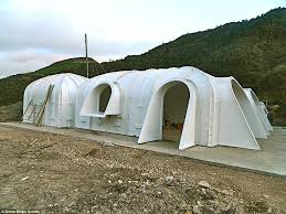 Ready Made Hobbit Homes Are Built Under A Layer Of Grass And Soil Green Magic Homes Hobbit House Underground Homes