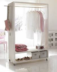 A whole open closet with lots of shelves is integrated over the door and on both sides to save as much space as possible. 38 Creative Clothes Storage Solutions For Small Spaces Digsdigs