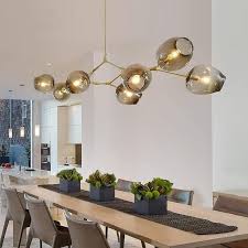 Whether you want your dining room to be elegant and formal or cozy and friendly, modern dining room lighting fixtures can be used to complete the ambiance. Moderni Shape Chandelier Modern Lighting Chandeliers Kids Room Lighting Dinning Room Lighting
