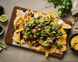 Raise your hand if you feel good after eating a giant plate of nachos! These Fully Loaded Vegan Nachos Are The Ultimate Healthy Party Snack