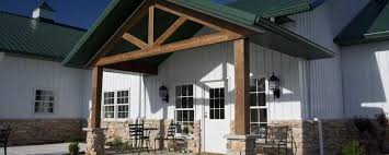 Pole barn homes have become popular because they now come in modern designs compared to their previous metallic look. Deluxe Pole Barn Lake House W Rustic Porch Stone Facade Hq Pictures Metal Building Homes