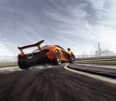 186/207 cars max:154/pro:109 bikes max:7/pro:6 f1 cars:4/complete:1 last car/bike added:aston. Hd Wallpaper Orange Sports Car On Race Track Road Under White Clouds Mclaren P1 Wallpaper Flare