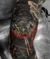 Selecting a snake for a tattoo can be exciting. Dark Ink Scary Snake Tattoo On Sleeve