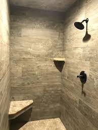 Our Master Shower Is A Wood Tile Walk In Shower With Grey Hexagon Tiles Shower Tile Tile Walk In Shower Tile Remodel