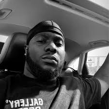 Officer Cliff Ward changing a tire for a elderly resident