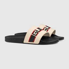 shop the gucci stripe rubber slide sandal by gucci a new distinct detail of the house the gucci jacquard stripe draws i slide sandals striped sandals sandals