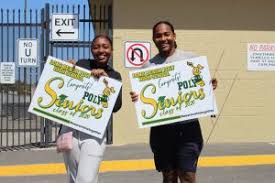 High School Seniors Celebrated With Yard Signs