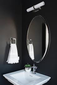 small powder room with black walls