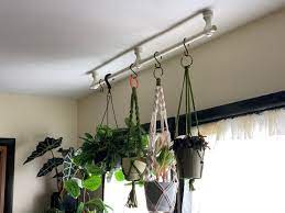 Ceilings made of drywall and lumber can easily support the weight of curtains, but you may find suspending a rod from ceramic or metal ceiling tiles difficult. Put A Curtain Rod On The Ceiling For My Green Babies To Hang From Houseplants