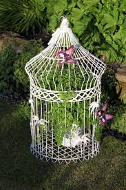 Large Bird Cage Decor Ideas Decorative Design With A Pointed Roof Is Embellished With Acrylic Butterflies For An Unusual Effect With Images Bird Cage Decor Bird Cage Large Bird Cages