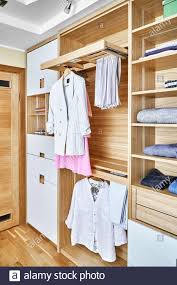 Lateral file cabinet with lock, 2 drawer lateral filing cabinet, large deep drawers locked by keys, metal storage file cabinet for hanging files letter/legal/f4/a4 size $185.99 $ 185. Modern Wooden Wardrobe With Clothes Hanging On Rail In Walk In Closet Design Interior 3d Rendering Stock Photo Alamy