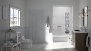 White towels hanging from hooks in a bathroom. Easy Affordable Bath Upgrades Kohler