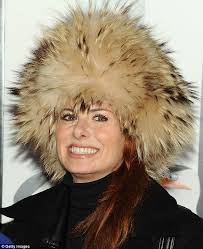 Debra Messing wears incredible headgear to ice-skate at the Penguins Of  Madagascar premiere